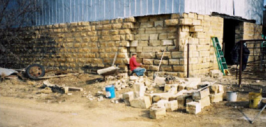 Rebuilding a barn foundation.